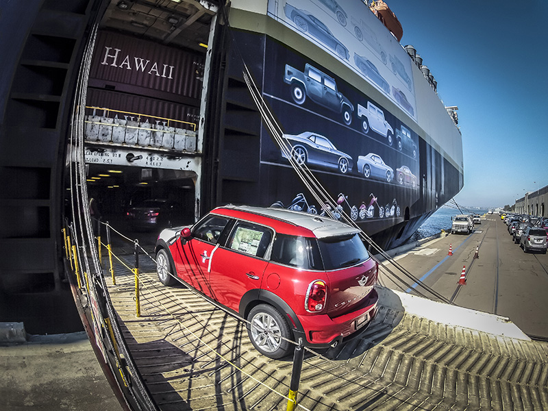 A Mini is loaded with the first BMW shipment to Hawaii aboard the Jean Anne